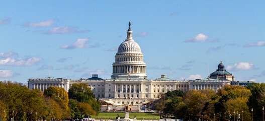 Panoramic image of the US Capitol building in Washington DC as seen from national mall This iconic place holds senate and congress. It is a sunny autumn day and clear sky with a few clouds