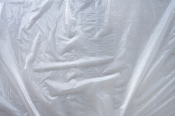 white grey textured winkled grungy sheet of plastic background backdrop