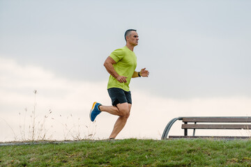 Older athlete exercising outdoors