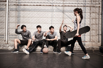 hipster young asian sport people having fun outdoors