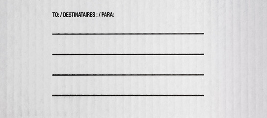 Blank space for the sender address on white paper card board. Front view of parcel box texture with...
