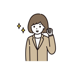 笑顔でガッツポーズをするスーツ姿の若い女性