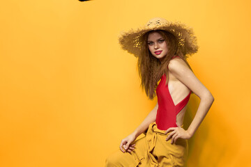 Woman in straw hat bright makeup summer lifestyle fun yellow background