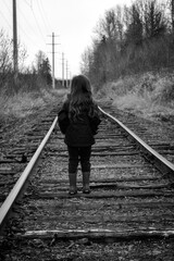 child on railroad