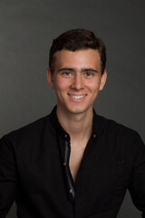 a young dark-haired man in black shirt