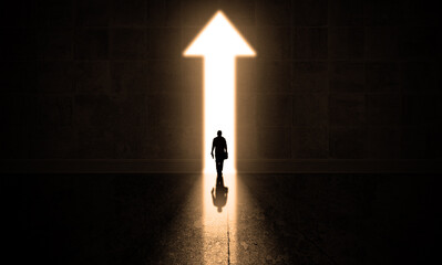 Businessman getting out from a dark hall thought a big arrow doorway, business arrow surreal...