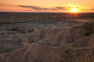 beautiful summer sunset on the sprawling vista of the Badlands National Park in South Dakota.