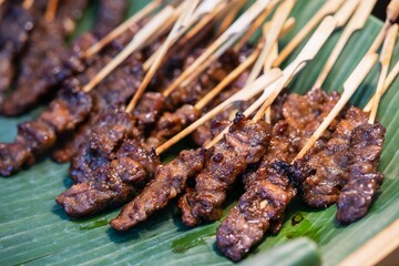 Close up of Grilled Beef Skewers with wood stick, thai street food market
