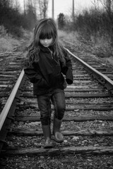 child on railroad