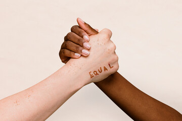 Equal word on two hands joining together background