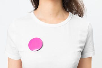 Pink empty badge pin on woman’s t-shirt with design space - obrazy, fototapety, plakaty
