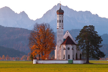 Beautiful view of the Saint Coloman church near the Neuschwanstein castle, against the backdrop of...