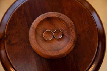 Gold rings for wedding ceremony on a stand 