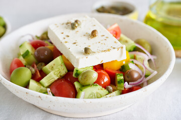 Greek village salad horiatiki with feta cheese and vegetables, vegeterian mediterranean food, low calories keto dieting meal, side view, close up