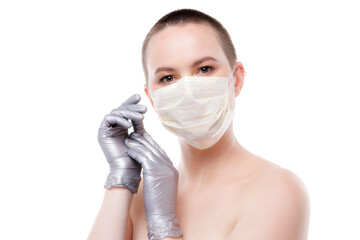 Beauty portrait of a short-haired woman in mask and gloves