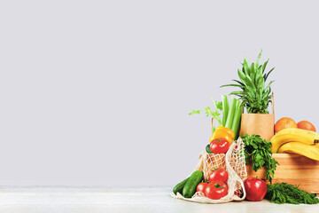 Delivery of grocery. box with fresh fruit and vegetables bright green produce. Eco friendly responsible lifestyle and shopping. Healthy eating, zero waste concept. Copy space. Donation.