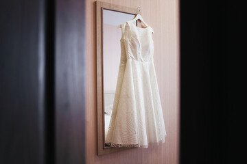 Wedding dress. Wedding fashion. Wedding dress on a hanger. Bride.
