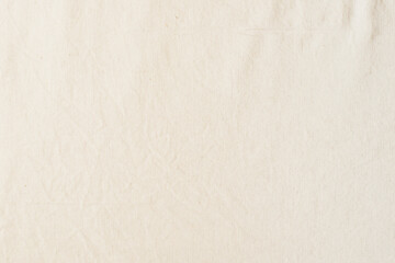 Abstract textile background from natural linen fabric of light color. Copy space