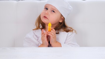 little girl plays a doctor, makes an injection. Corona virus treatment concept, injection during pandemic