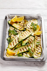 grilled zucchini slices on a sheet pan