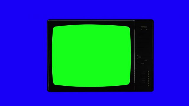 Authentic Old TV Turning On Green Screen Over Blue Background.