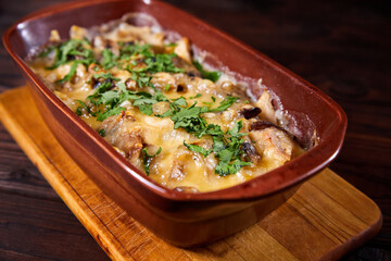 Baked meat with mushrooms and cheese. Al forno. Close-up, selective focus