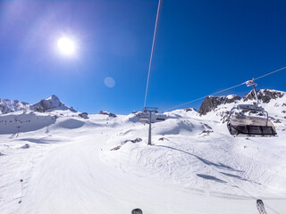 Fototapeta na wymiar winter skiing area with cable car in sunny day
