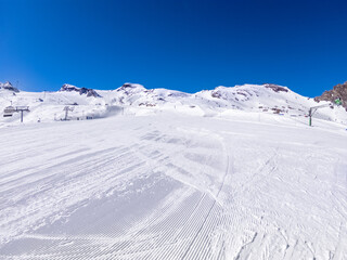 winter skiing area on a glacier with a ski slope