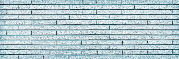 Old vintage retro style blue bricks wall for panorama brick background and texture.