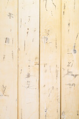 Old beige wooden background from damaged boards, vertical photo