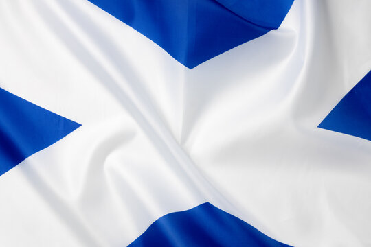 Folded national flag of Scotland, fabric background