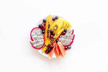 Mixed tropical exotic fruit in white dish