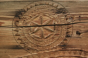 Fototapeta na wymiar Amulet, wood carving, flower of Life