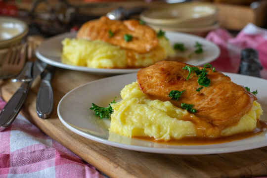 Italian fried chicken breast in milk sauce with mashed potatoes