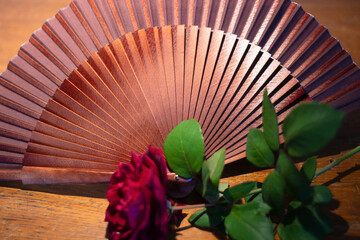 an ancient Spanish fan and a love rose