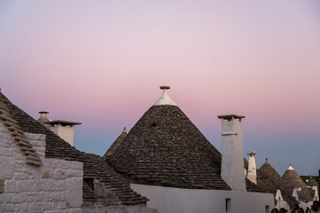 Fototapeta na wymiar roofs of traditonal trullis in Alberobello at twilight, Puglia