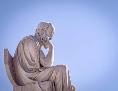 Socrates the ancient Greek philosopher and thinker white marble statue under blue sky, space for your text
