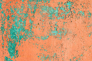 Old flaky paint on a metal surface. Red green grunge texture