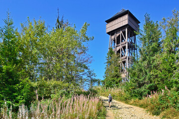 Fototapeta na wymiar Lookout wooden tower for tourists on the top of the Luban peak in Gorce mountains, Poland