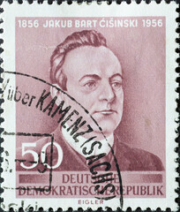 GERMANY, DDR - CIRCA 1956 : a postage stamp from Germany, GDR showing a half-length portrait of the Sorbian poet Jakub Bart-Ćišinski based on a model by Horst Schlosser. For the 100th birthday