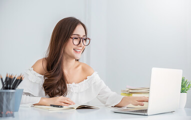 Portrait of smiling beautiful business asian woman working in office use computer with copy space. Business owner people sme freelance online marketing e-commerce telemarketing, work from home concept