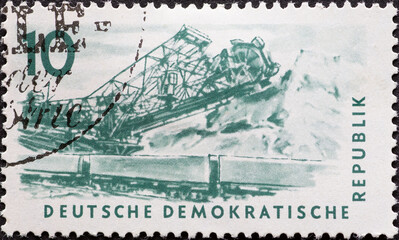 GERMANY, DDR - CIRCA 1957 : a postage stamp from Germany, GDR showing the drawing of a Bucket wheel...