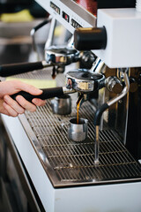 Coffee machine and bartender hands making coffee