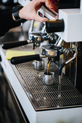 Coffee machine and bartender hands making coffee