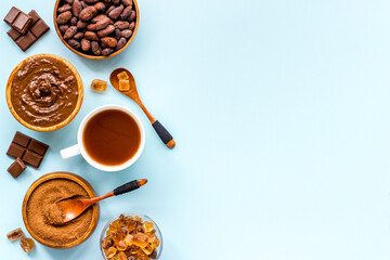 Coffee and cocoa beans and ground powder with hot chocolate drink