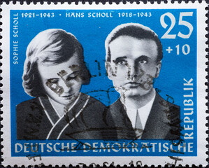 GERMANY, DDR - CIRCA 1961 : a postage stamp from Germany, GDR showing a portrait of the resistance fighters against Hitler, the siblings Sophie Scholl and Hans Scholl