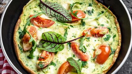 Frittata with fresh vegetables and cheese. Italian omelet in the pan. Keto, ketogenic lunch. Food recipe background. Close up