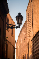 Fototapeta na wymiar lantern in a narrow alley of Ostunis oldtown, Puglia