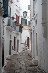 narrow alley of Ostunis oldtown, Puglia