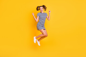 Fototapeta na wymiar Photo portrait full body view of excited woman jumping up celebrating isolated on vivid yellow colored background